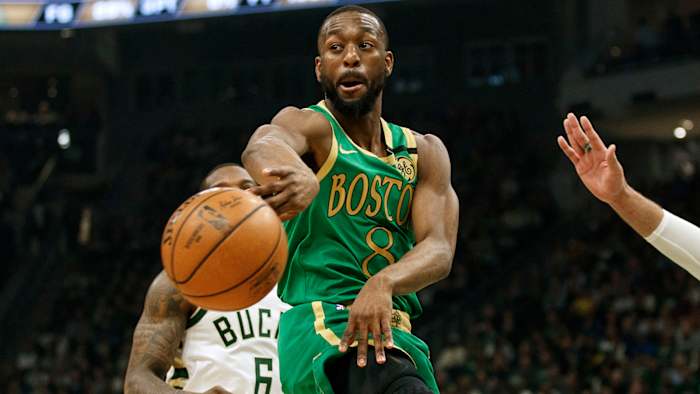 Kemba Walker passes the ball against the Milwaukee Bucks